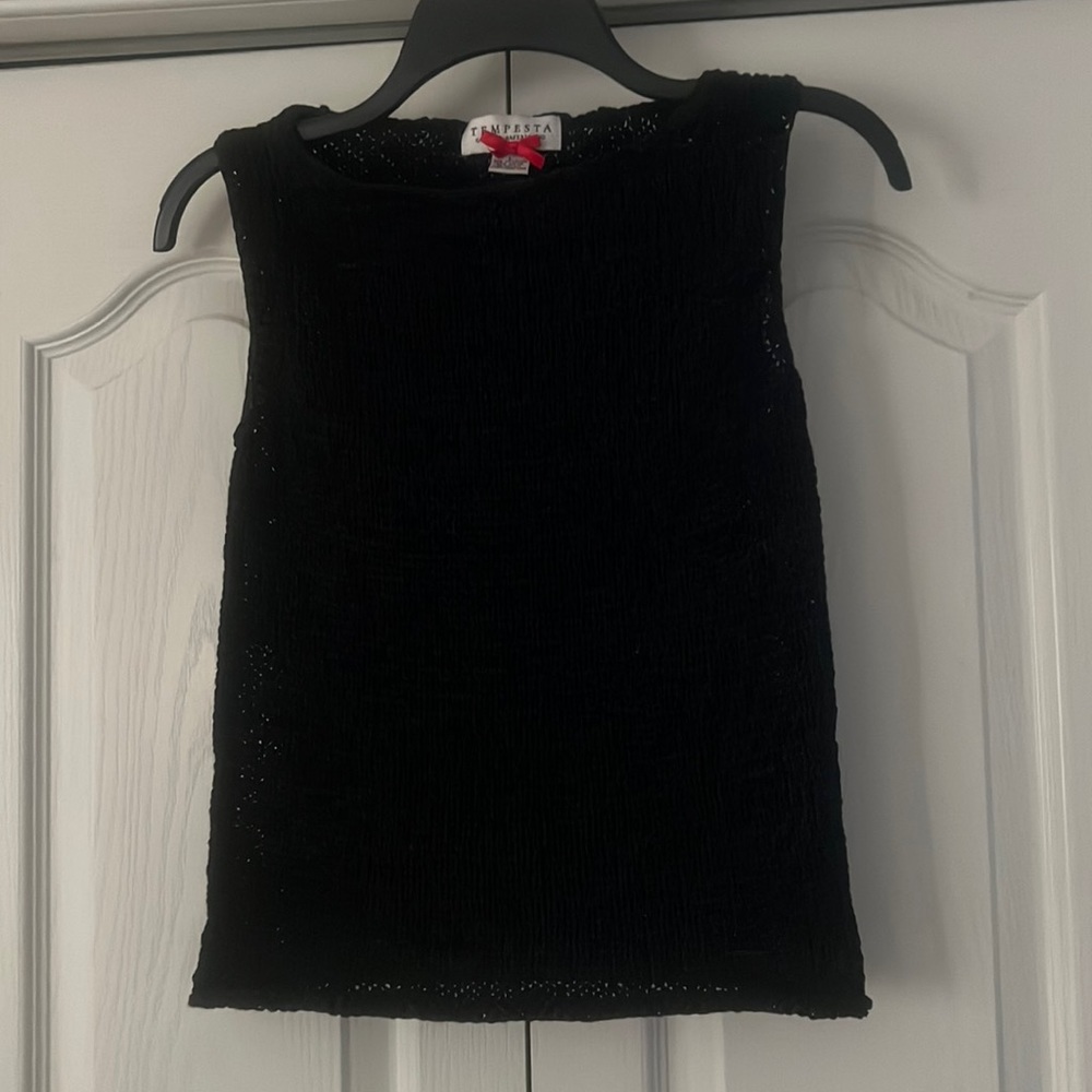 Sleeveless sweater.